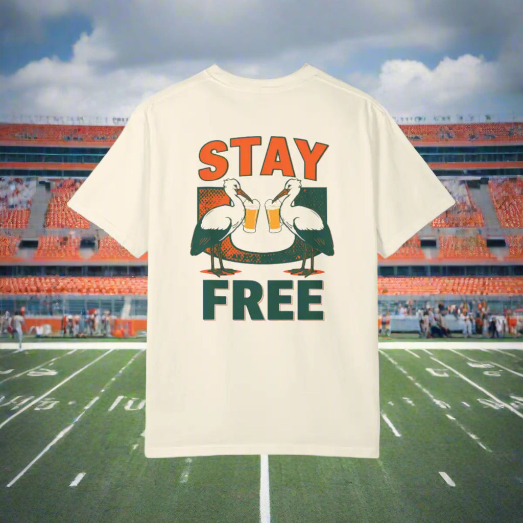 Beige t-shirt with 'Stay Free' graphic design on a white background